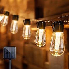 solar powered string lights hanging from a wooden beam