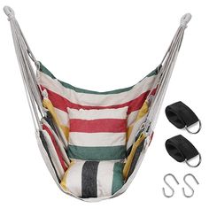 a striped hammock chair with two black and white hooks attached to the back