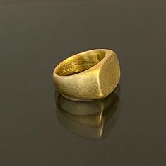 18k solid gold Signet Ring, 18k gold Square Statement Ring, Handmade, Fine Jewelry, Unisex gold signet ring Resizable. Available in 14k solid Gold & silver Size 13.5 US size 6.5 Weight 14.8g Square top 11 mm \ 16 mm (Please contact me for a different size or metal and the Price) Free Shipping! You are welcome to visit my shop for more of my designs: https://www.etsy.com/shop/GoldArtJewelry More Rings: https://www.etsy.com/shop/GoldArtJewelry Please take a moment to read my shop policies befo Matte Gold 14k Gold Rings For Gift, Matte Gold 14k Rings For Gifts, Formal 22k Gold Ring Engraved, Modern Gold Signet Ring For Formal Occasions, Gold Signet Ring In Recycled Gold For Formal Occasions, Formal Gold Signet Ring In Recycled Gold, Luxury Ring With Smooth Bezel For Gift, Luxury Ring With Smooth Bezel As A Gift, Luxury Recycled Gold Ring In Gold Color