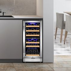 a wine cooler in the middle of a kitchen