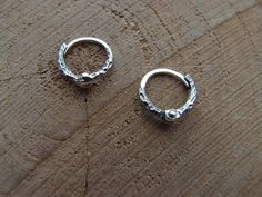 Forged small sterling silver hoop earrings  . Handcrafted unisex jewelry. All our jewelry can be made in sterling silver, bronze or 14k gold. Material:  Sterling Silver Size: 10mm (0.4inch) Please find more stunning earrings in our workshop  https://www.etsy.com/shop/NordicForces?ref=seller-platform-mcnav§ion_id=29287703  We ship worldwide with tracking= *Optionally you can also use DHL expedited shipping*  And feel free to ask us any questions Silver Sterling Silver Nose Rings For Anniversary, Anniversary Sterling Silver Nose Rings, Sterling Silver Huggie Earrings For Gifting, Sterling Silver Clasp Small Hoop Huggie Earrings As Gift, Gift Sterling Silver Huggie Earrings, Gift Small Hoop Huggie Earrings With Sterling Silver Clasp, Gift White Gold Sterling Silver Nose Rings, Sterling Silver Huggie Jewelry, Sterling Silver Huggie Jewelry With Silver Clasp