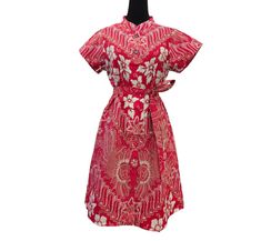 A beautiful red batik dresses on cheongsam neck and on flower and parang batik motifs.  ❤️ Flower is reflection of a beauty. ❤️ Parang is one of the classic batik motif.  Parang is symbolize of strength and unity. Size chart Bust 90cm Sleeves 14cm Length 95cm Red Summer Dress With Stand Collar, Red Short Sleeve Dress With Batik Print, Red Fitted Dress With Batik Print, Fitted Red Dress With Batik Print, Red Cotton Batik Print Dresses, Red Cotton Dress With Batik Print, Traditional Ao Dai With Floral Print, Traditional Red Ao Dai For Summer, Red Ao Dai For Summer