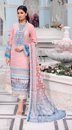 In a blissful rose pink with blissful indigenous thread work in rich ivory, blue, and rose hued silk threads, ‘Sanya’ paints a true picture of feminine elegance. Paired with an airy contrasting woven burnout dupatta featuring a mesh of traditional motifs and a classic trouser with an embroidered border, this grand and airy design is perfect for fancy iftaar dinners and Eid festivities that await us. Printed Woven burnout Dupatta Schiffli on Digital Printed Lawn Front Digital Printed Lawn Back + Unstitched Dress Material, Pakistani Salwar Kameez, Classic Trousers, Embroidered Border, Sanya, Lawn Suits, Embroidered Neckline, Suit Fabric, Pakistani Outfits