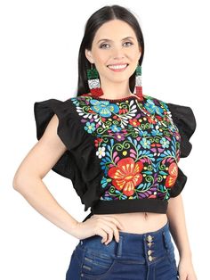 This unique piece features intricate floral embroidery, capturing the essence of traditional Mexican design. Earrings are sold separately Multicolor Embroidered Folk Fabric, Folk Style Floral Embroidered Top For Festive Occasions, Festive Folk Style Embroidered Top With Floral Embroidery, Multicolor Folk Style Embroidered Fabric, Multicolor Floral Embroidered Fabric, Folk Style Multicolor Embroidered Top For Festive Occasions, Folk Style Embroidered Top With Floral Print, Traditional Multicolor Embroidered Floral Top, Multicolor Embroidered Top For Festivals With Floral Design