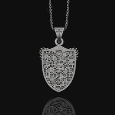 This intricately crafted Silver Archangel Micheal Pendant is a statement piece that everyone should have in their collection. It is made of pure, high quality sterling silver, delicately engraved with symbols of the angelic realm. Featuring an image of angelic figure of Archangel Micheal in mid-flight, this beautiful pendant is sure to evoke feelings of hope and protection. The pendant is suspended from a delicate silver chain, making it perfect for everyday wear. The Silver Archangel Micheal Pe St Michael Archangel, Michael Archangel, St Michael The Archangel, Michael The Archangel, Angelic Realm, Chain Making, Archangel Michael, St Michael, Silver Pendants