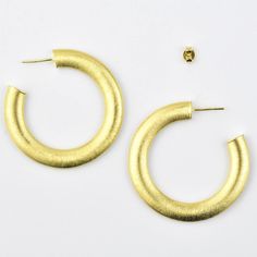 Earrings drop approximately 1.75 inches Post style earrings Gold over brass Brushed texture Imported from Brazil More from Creative Brazil About Creative Brazil Collection Jewelry handmade in Brazil that combines tropical and mid-century design sensibilities. Goldmakers Jewelry Mission Statement Goldmakers Jewelry creates and curates a comprehensive selection of artfully designed hand-crafted jewelry. We aspire to offer the jewelry enthusiast access to affordable classics as well as fresh innova Modern Textured Gold Earrings, Modern Textured Drop Earrings, Modern Textured Small Hoop Earrings, Modern Textured Round Earrings, Artfully Designed, Mission Statement, Earrings Drop, Crafted Jewelry, Free Gift Wrapping