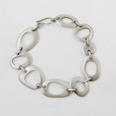 Mid Century styling, satin finish, organic shapes bracelet. -approx. 7 1/2" long, 3/4" wide -s clasp closure-BA352 Linked Bracelet, Modern Jewellery, Organic Shapes, Modern Classic, Satin Finish, Sterling Silver Bracelets, Bling Bling, Link Bracelets, Amazing Things