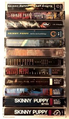 many dvds stacked on top of each other in a stack with the words skinnyy puppy printed on them