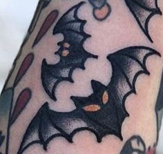 a bat tattoo on the arm and leg