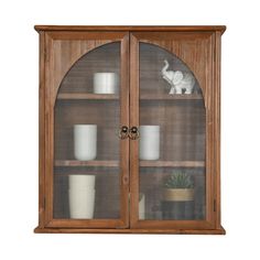 a wooden display case with glass doors and shelves filled with pots, vases and other items