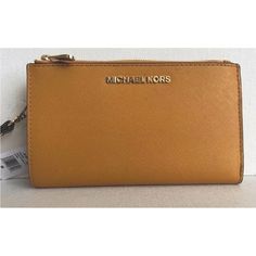 New With Tags 100% Authentic Michael Kors Jet Set Travel Double Zip Wristlet Wallet Marigold With Gold Tone Hardware Saffiano Leather Snap Closure Lined Removable Wristlet Strap 7" Interior Features Zip Pocket, Three Inner Pockets, And 6 Card Holders Id Window Phone Holder, Good For Iphone 8+ Logo Plaque On Front 2 Zip Closure Compartments Length: 7 1/4" Depth: 1 1/2" Height: 4" Travel Wallets With Gold-tone Hardware, Gold Travel Clutch With Removable Pouch, Elegant Gold Wallet With Zipper Closure, Michael Kors Travel Wallets With Gold-tone Hardware, Michael Kors Gold Wallet For Everyday Use, Gold Michael Kors Wallet For Everyday Use, Gold Wallet With Removable Pouch For Everyday, Gold Wallets With Card Slots For Daily Use, Gold Clutch Bag With Card Slots