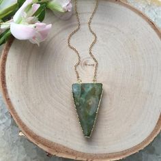 A gorgeous piece of pale green agate.  I love this pendant!!  Comes suspended on a gold plated chain.  I think it looks best on a long 30" or 35" chain!  But you could totally wear this on a shorter chain too!  - Electroplated Agate Triangle- 14k Gold Plated ChainYou will receive the exact pendant shown!Select your desired length at check out. If you want a length that is not listed just send me a message.This necklace is custom made to your preferences and will be ready to ship within 3-5 days. Gold Jade Gemstone Crystal Necklace, Gold Jade Crystal Necklace With Gemstone, Gold Moss Agate Pendant Jewelry, Gold Jewelry With Natural Moss Agate Stones, Gold Moss Agate Spiritual Necklace, Bohemian Gold Aventurine Necklace, Bohemian Gold Jewelry With Moss Agate, Gold Jade Crystal Necklace As Gift, Gold Jade Crystal Necklace Gift