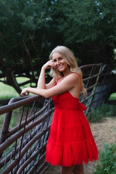 A model in a delicate straps and soft tulle fabric, this dress will put the finishing touch on any look. The bow tie at the waist adds a sweet touch, making it the perfect accessory for your next homecoming! Red Hoco Dress Flowy, Red Mini Dress With Sweetheart Neckline For Prom, Flowy Homecoming Dresses, Spring Prom Mini Dress With Bow, Red Ruffled Mini Dress, Elegant Red Mini Dress With Bow, Hoco Dress, Soft Tulle, Hoco Dresses