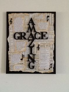 a piece of paper with the words grace and music written on it, hanging on a wall