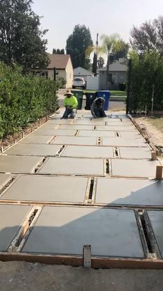 two men are working on the construction of a house