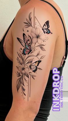 a woman's arm with flowers and butterflies tattoo on the back of her shoulder