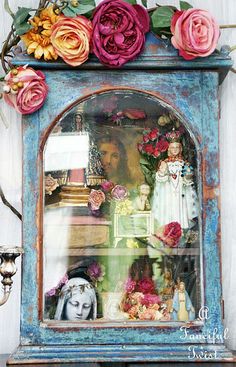 an old clock with flowers on the front and back sides, painted in bright colors