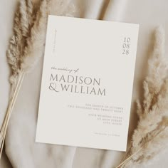 the wedding program is on top of some dried grass