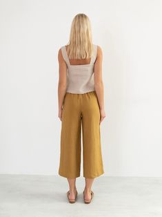 "BEA is a sleeveless, loose fitting linen tank top. DETAILS - Wide straps - Square neckline - Sleeveless design - 100% lightweight European linen fabric - Cut and sewn to order just for you in our studio COLOR - Beige, you can also choose other colors above - Fabric samples are available here https://www.etsy.com/listing/586569696/linen-fabric-samples SIZING & FIT - Fits true to size - Length (shoulder to hem) is approximately 20 inches / 51 cm - Bust (pit to pit) is approximately inches 17. Beige Linen Sleeveless Tank Top, Linen Sleeveless Tank Top For Vacation, Sleeveless Linen Tank Top For Vacation, Beige Sleeveless Linen Top, Chic Linen Cami Tank Top, Beige Linen Tank Top For Beach, Beach Sleeveless Linen Tank Top, Sleeveless Linen Tank Top For Beach, Chic Linen Camisole Tank Top