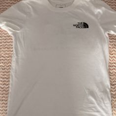 White Tee With Back North Face Logo On Left Chest, Rainbow North Face Graphic Square On Back With “Never Stop Exploring” In Black. Women’s Size Xsmall, But Could Fit A Small/Medium. Brand New. Casual Crew Neck T-shirt By The North Face, The North Face Cotton Short Sleeve T-shirt, The North Face Cotton Crew Neck T-shirt, The North Face Crew Neck T-shirt For Streetwear, The North Face Streetwear Crew Neck T-shirt, The North Face Sporty Cotton Tops, The North Face Sporty Crew Neck Top, Sporty Crew Neck Top By The North Face, Sporty The North Face Cotton Tops