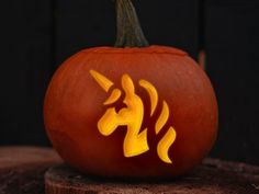 a carved pumpkin with an image of a unicorn on it