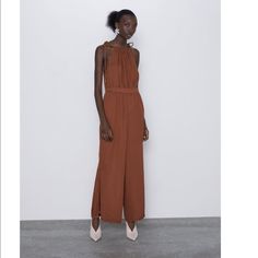 Nwt. Flowy Halter Neck Jumpsuit With Matching Cord Straps. Interior Elastic Waistband. Chic Brown Jumpsuits And Rompers For Summer, Elegant Brown Jumpsuits And Rompers For Summer, Elegant Brown Summer Jumpsuits And Rompers, Chic Brown Jumpsuits And Rompers For Spring, Chic Brown Jumpsuits And Rompers For Day Out, Zara Casual Party Jumpsuits And Rompers, Zara Jumpsuits And Rompers For Summer, Zara Store, Straps Jumpsuit