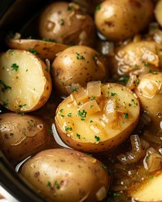 cooked potatoes with herbs in a slow cooker, ready to be served for dinner