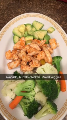 a plate with broccoli, cauliflower, carrots and chicken on it