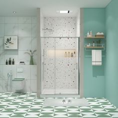 a bathroom with green and white tiles on the floor, shower stall and sink area