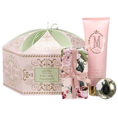 a pink gift set with a green bow