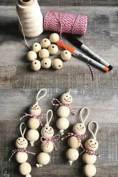 several wooden beads are tied up with twine and some other crafting supplies next to them