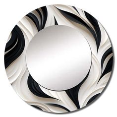 a round mirror with black and white swirls on the front, against a white background