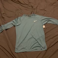 Dri-Fit Material - Never Been Worn - Tags Still Attached Casual Long Sleeve Sports Shirt, Light Blue Long Sleeve Sports Top, Nike Long Sleeve T-shirt For Spring, Nike Green Long Sleeve Tops, Blue Stretch Nike Tops, Nike Casual Long Sleeve Shirt, Fitted Blue Nike Tops, Nike Blue Long Sleeve Tops, Sporty Light Blue Nike Tops