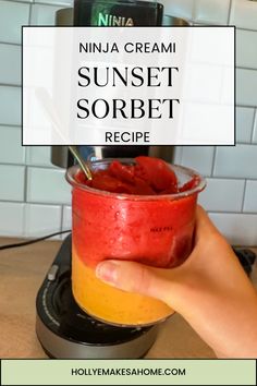 a person holding up a glass with some fruit in it and the words ninja cream sunset sorbet recipe