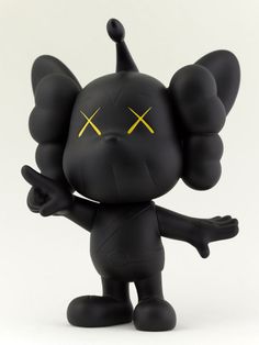 a black toy with yellow crosses on its eyes