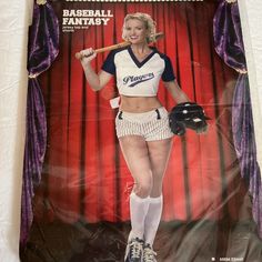 a woman dressed as a baseball player holding a bat