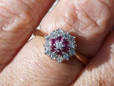 A traditional cluster ring in gilded sterling silver set with Rubies and Cubic Zirconias Created Rubies. Finger size L 1/2 (uk) or 5 3/4  (usa) In excellent condition. Heavy gilding Partial hallmarks for London sterling. C1990 Will come boxed. Cluster Ring, Cubic Zirconia, Ruby, Jewelry Rings, Ring Size, Wedding Rings, Engagement Rings, Sterling Silver, Silver