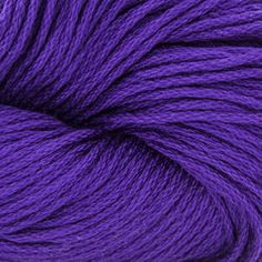 purple skeins of yarn on a white background