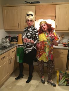 two women standing in a kitchen next to each other