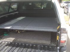 the back end of a pickup truck with an open bed