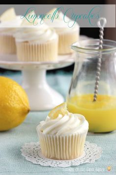 lemon cupcakes with white frosting on a table