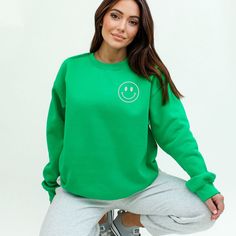 Looking for a cute versatile top to wear? Make sure to grab one of our Graphic Sweatshirts! This soft and comfortable shirt is the perfect top for any outfit. It can be paired with biker shorts, Jeans, or the classic stay at home sweats! This sweatshirt is true-to-size, so be sure to order your regular size! If you are looking for a more oversized look, make sure to size up. Green Spring Sweatshirt For Everyday Wear, Cute Long Sleeve Tops For Everyday, Green Crew Neck Cute Sweater, Green Basic Sweater With Relaxed Fit, Green Basic Sweater In Relaxed Fit, Green Relaxed Fit Basic Sweater, Cute Green Crew Neck Sweater, Cute Green Top For Loungewear, Green Long Sleeve T-shirt For Loungewear