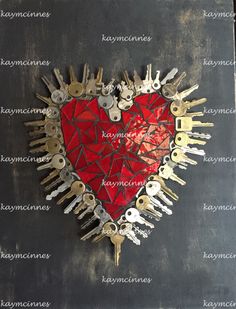 a red heart with lots of keys attached to it