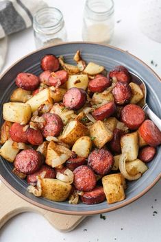 a bowl filled with potatoes and meat on top of a table