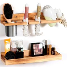 two wooden shelves holding various beauty products and hairbrushes on top of each shelf