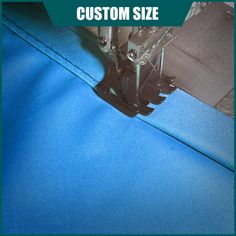 a blue piece of fabric with the words custom size on it and an image of a sewing machine