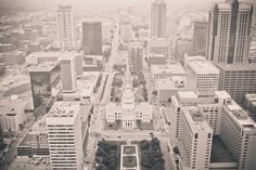 an aerial view of the city with tall buildings