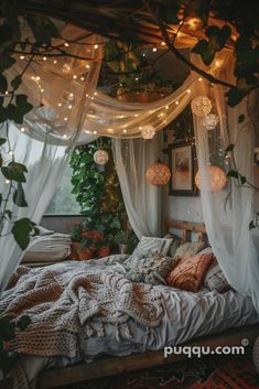 a bed with white curtains and lights hanging from it's headboard, surrounded by greenery