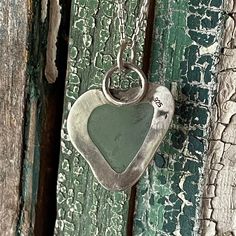 This Pale Aquamarine Heart shaped Sea Glass was found on the Big Island of Hawaii. It was handcrafted with 925 sterling silver and fine silver. Twisted wire accents this bezel. The back of the pendant has a peek-a-boo heart. Patina has been added to give the necklace a tarnished look. 16" Sterling Silver Chain is included This heart was found in this shape. Finding a heart shaped piece of sea glass is rare. I've been collecting sea glass for over 10 years. I have over a 1000 pieces of sea glass Sea Glass Heart, Glass Heart Necklace, Sea Glass Colors, Big Island Of Hawaii, Island Of Hawaii, The Big Island, Twisted Wire, Sea Glass Necklace, Jewelry Show