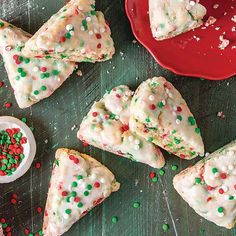 several pieces of pizza on a table with sprinkles and a red plate